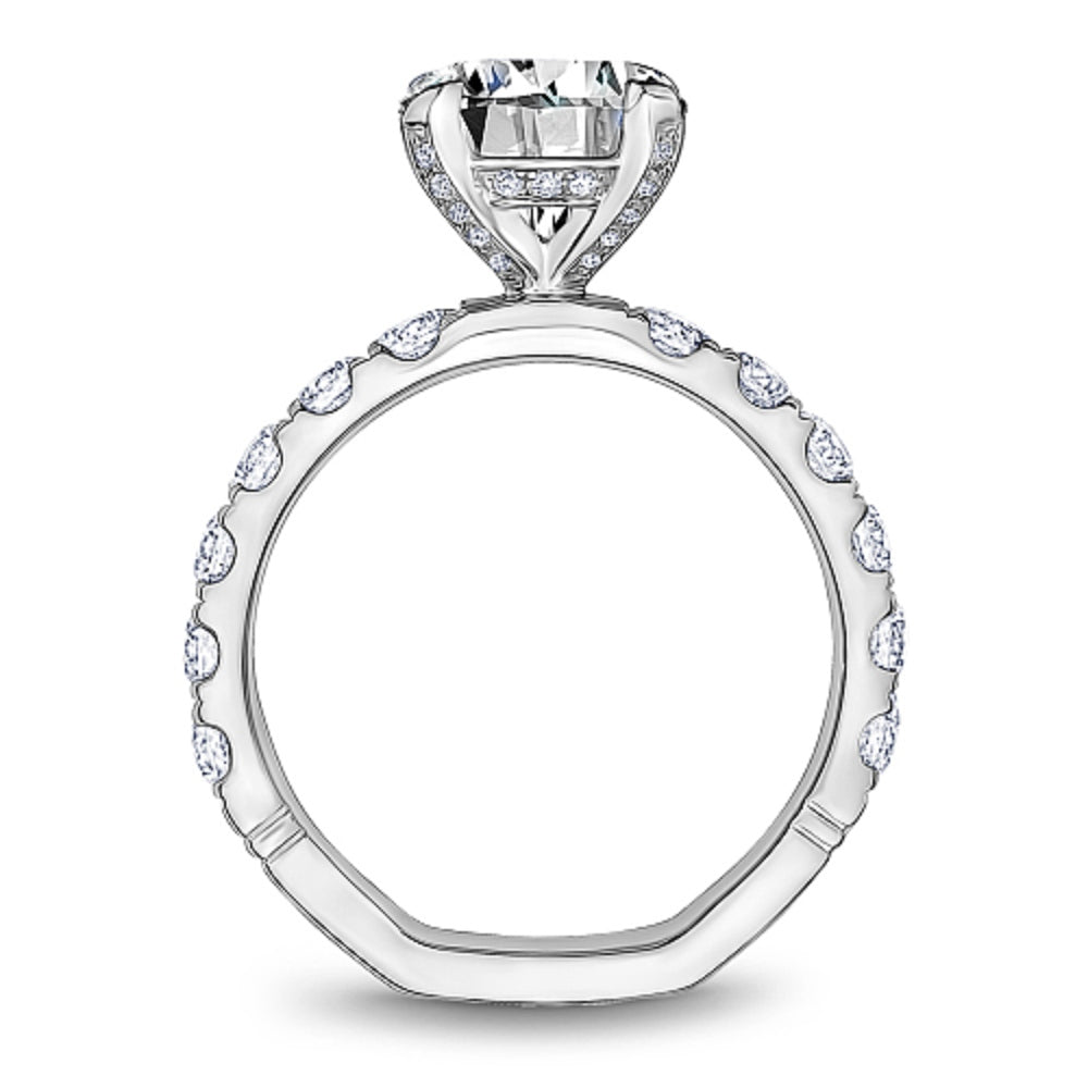 Diamond ring with 'Noam Carver' branding on a white background