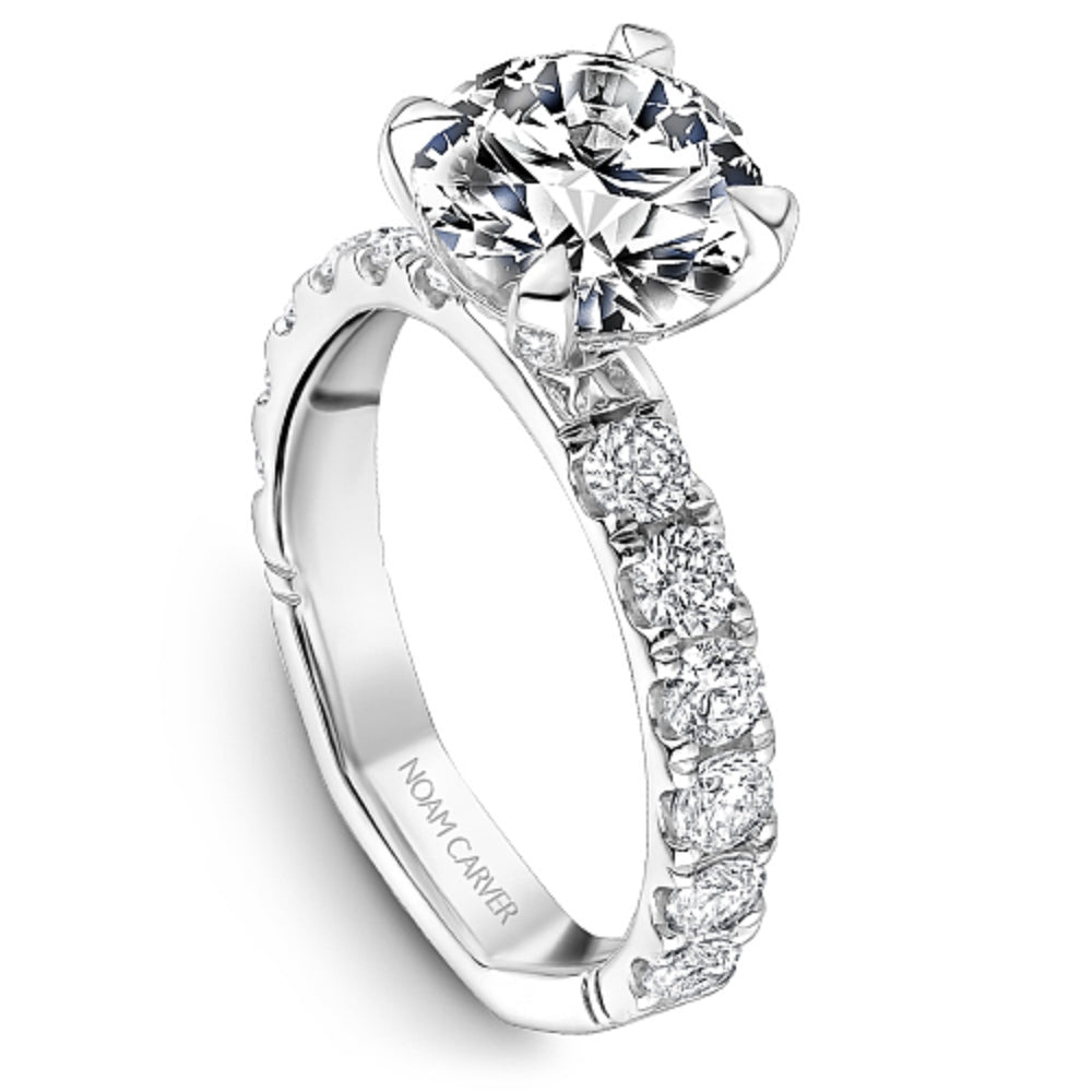 Diamond ring with 'Noam Carver' branding on a white background