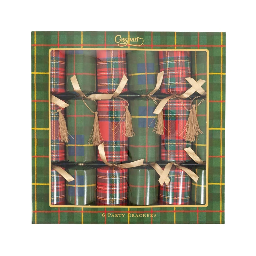 A boxed set of six party crackers in a green tartan-patterned package with a clear window showing the crackers tied with beige ribbons and tassels.