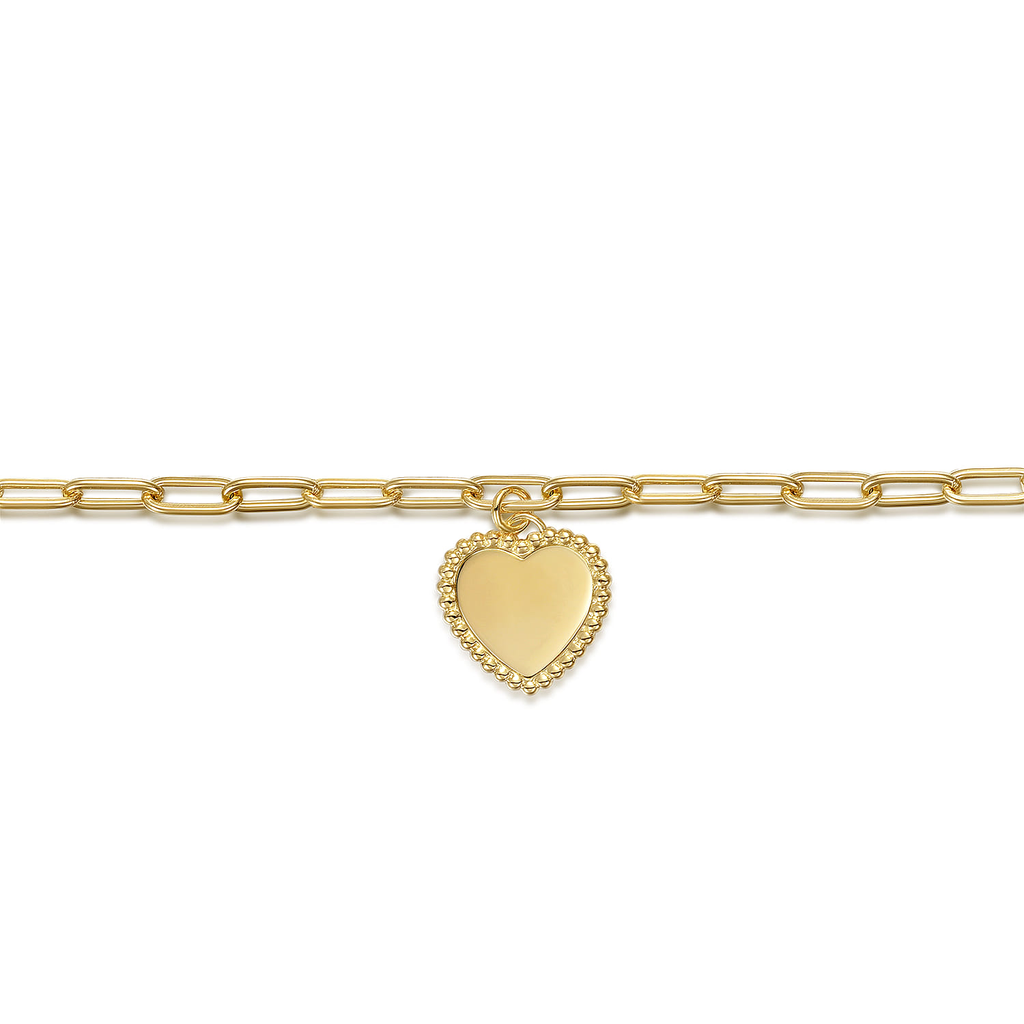 gold bracelet with heart drop on white background