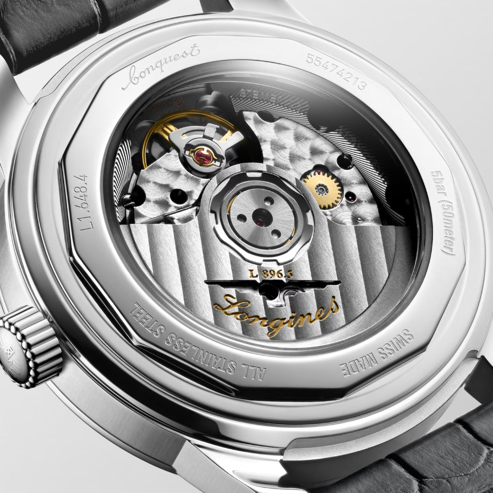Close-up of a Longines watch mechanism with visible branding