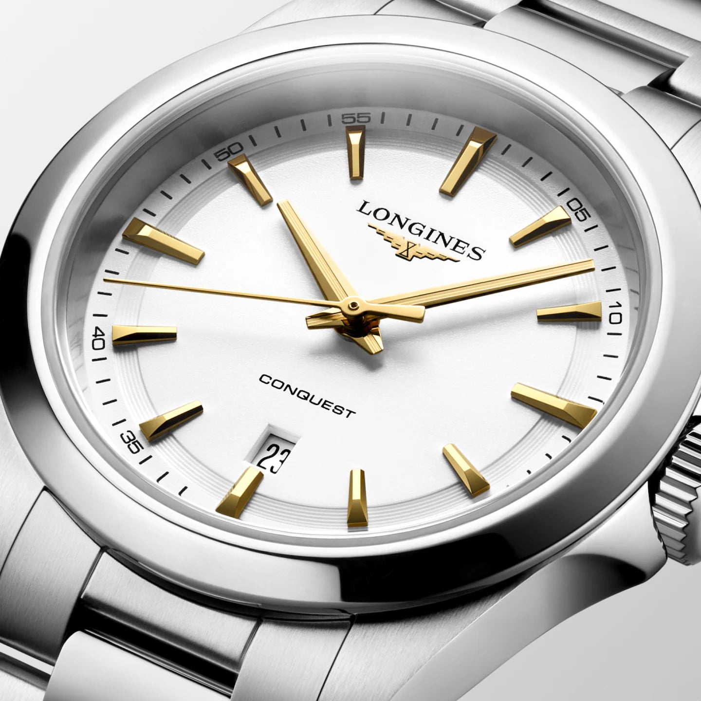 Longines watch with white face and gold accents on a white background