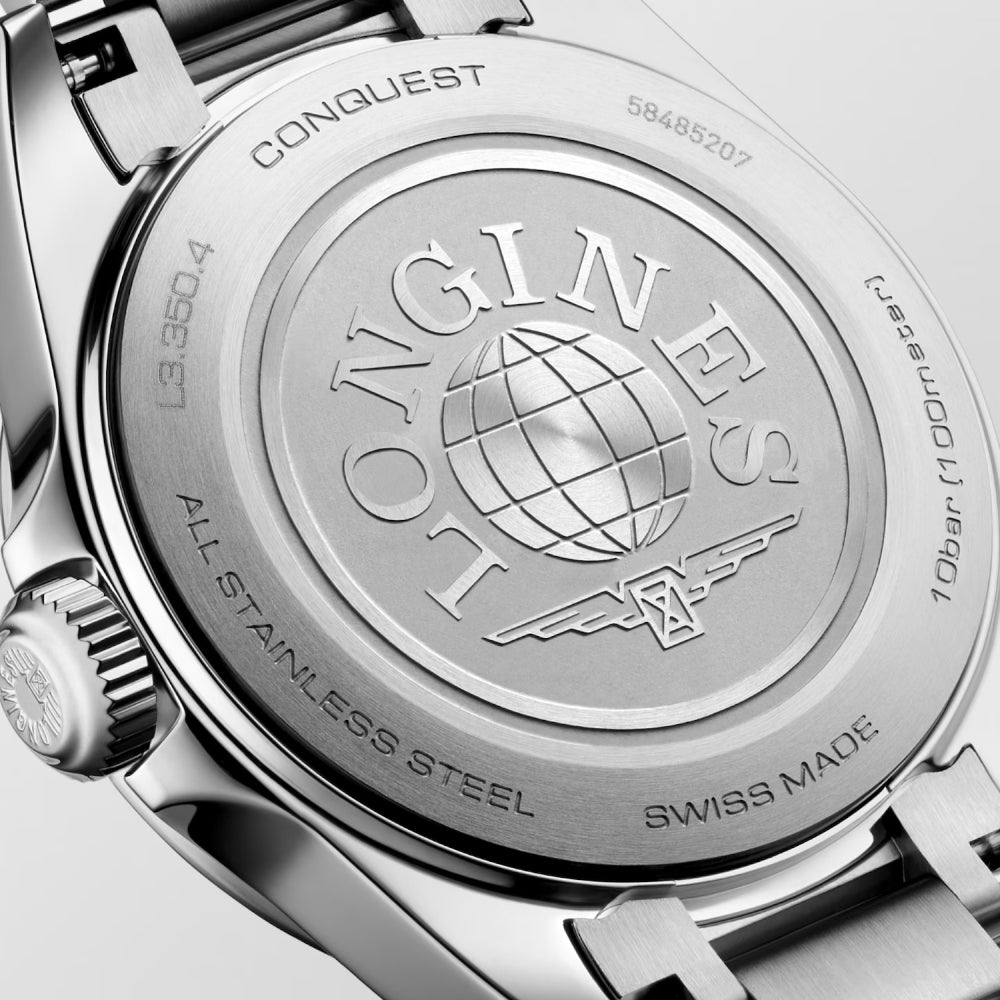 Close-up of a watch case with 'Longines' branding and 'Swiss Made' text.
