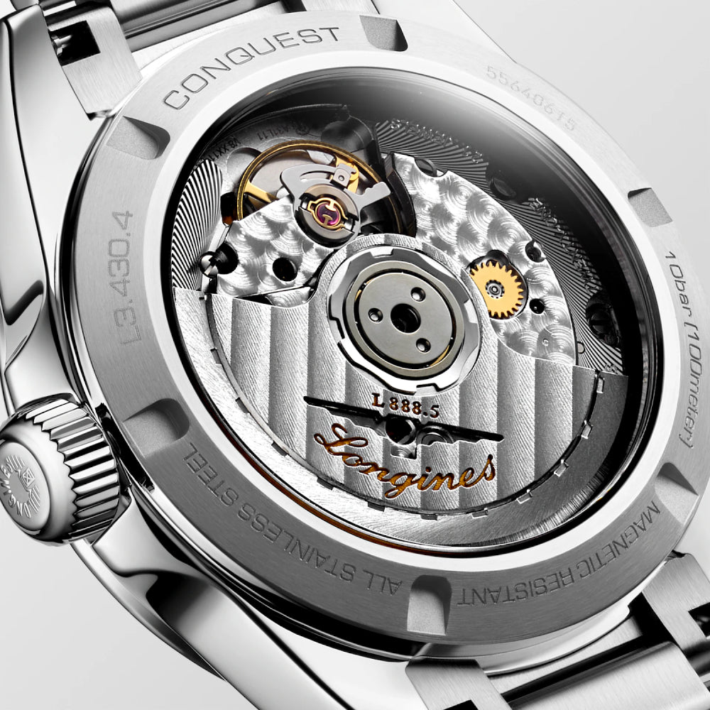 Close-up of a luxury watch with 'Longines' branding and visible mechanical components.