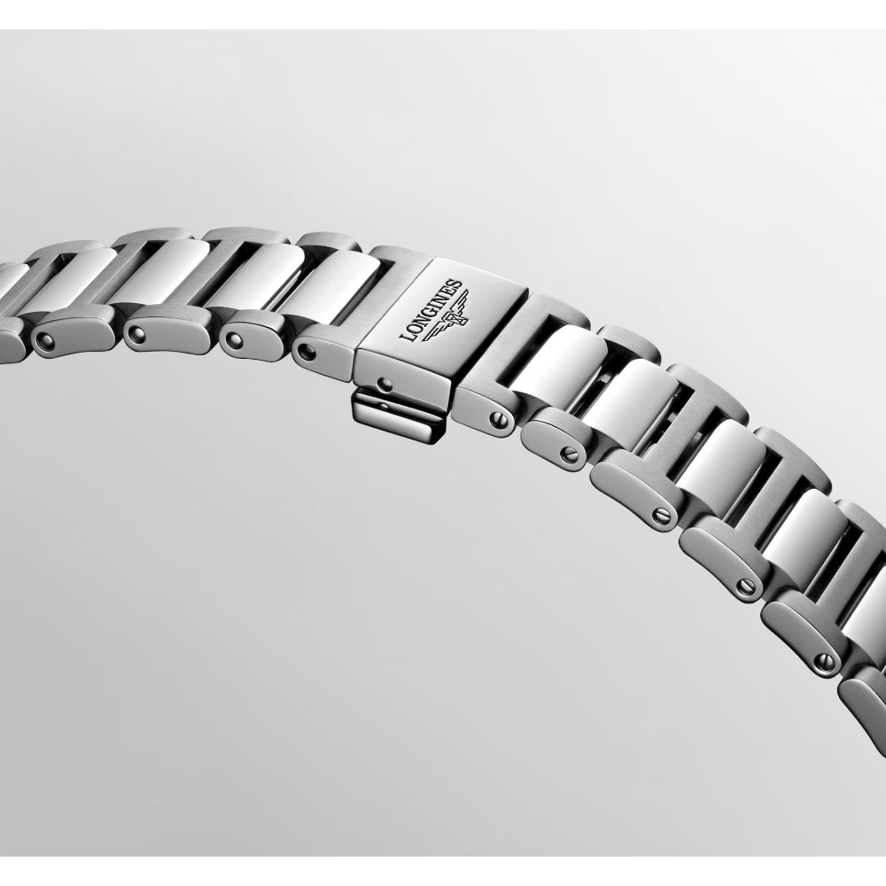 Silver watch bracelet on a light gray background