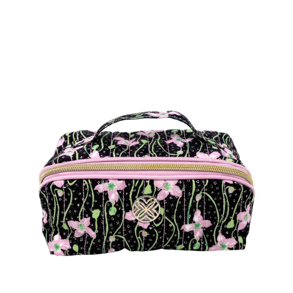 A rectangular zippered cosmetic bag with a black background, pink flowers, and green stems, featuring a gold-tone zipper and a decorative metal emblem on the front.