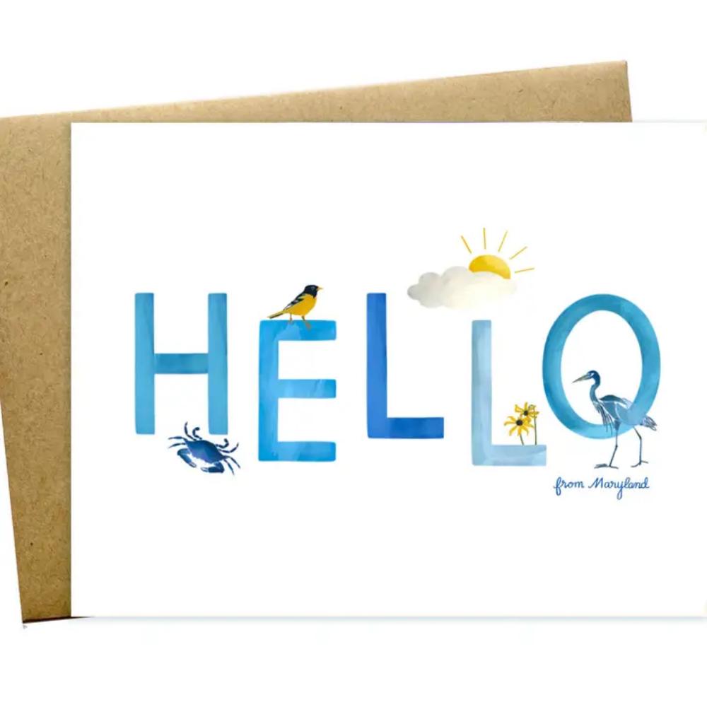 A horizontal greeting card with the text 'HELLO' printed in blue letters, each letter adorned with a different illustration, such as a bird and a crab. The card is accompanied by a kraft envelope.