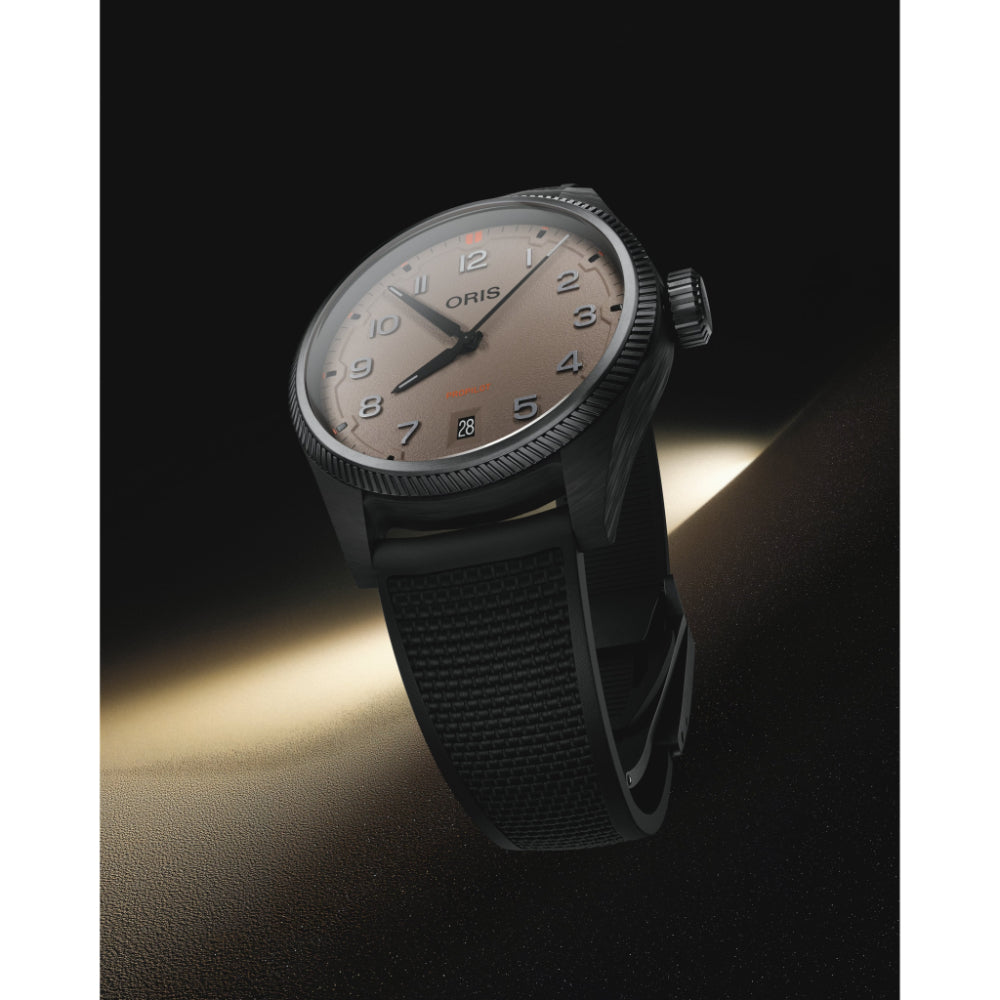 Black wristwatch with a dark strap on a dark background