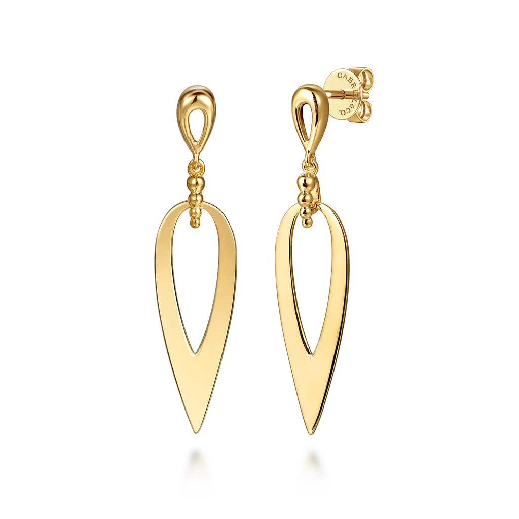Gold earrings on a white background