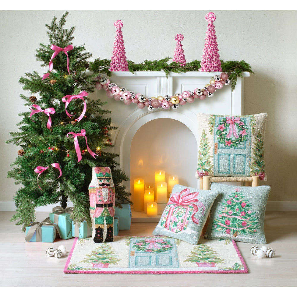 Decorative Christmas scene with a tree, fireplace, and festive decor.