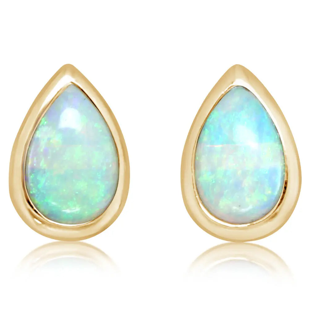 Teardrop-shaped opal earrings with gold frames on a white background