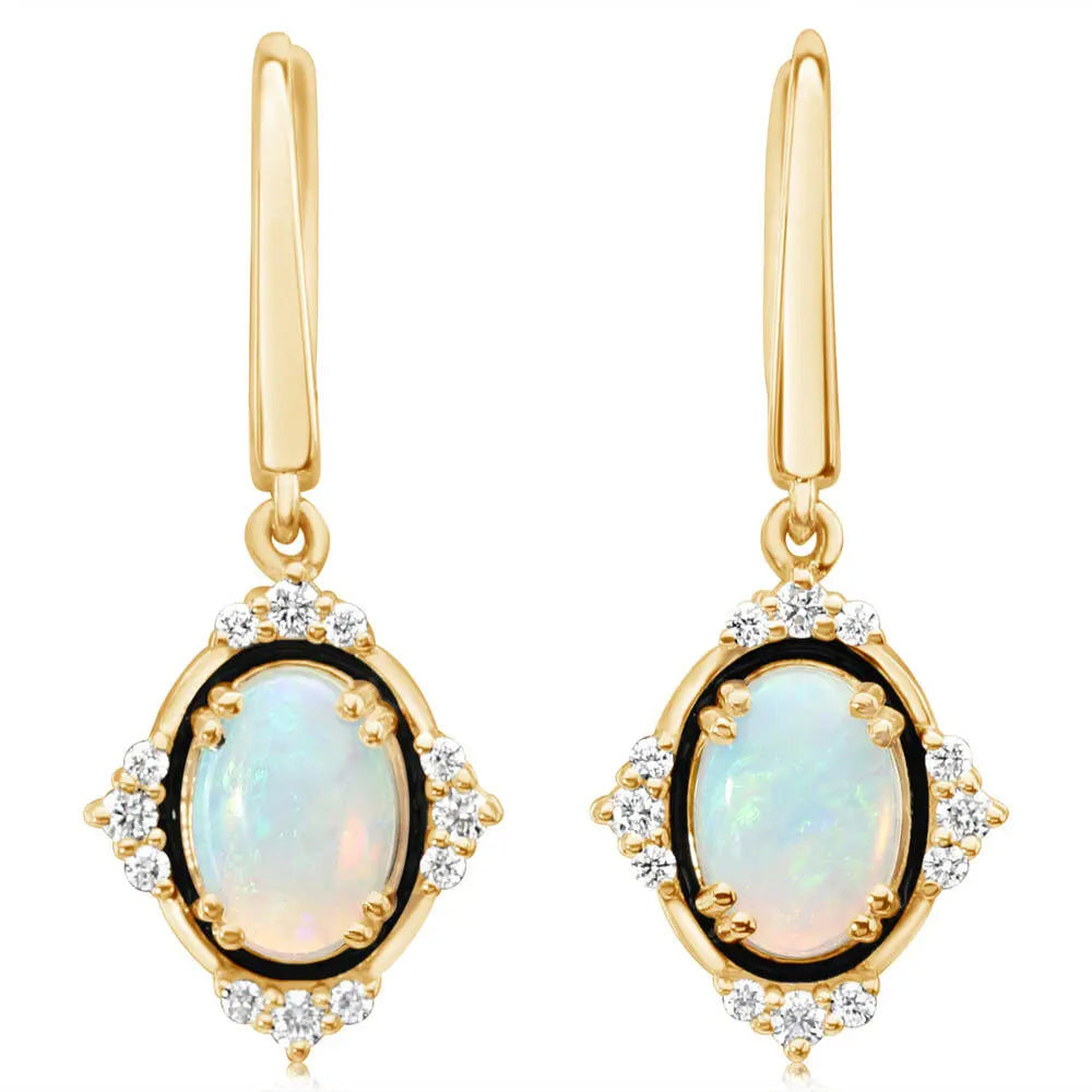 Gold earrings with opals on a white background