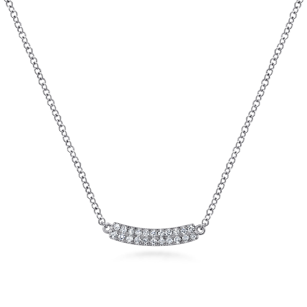 Silver necklace with a curved chain and small diamonds on a white background
