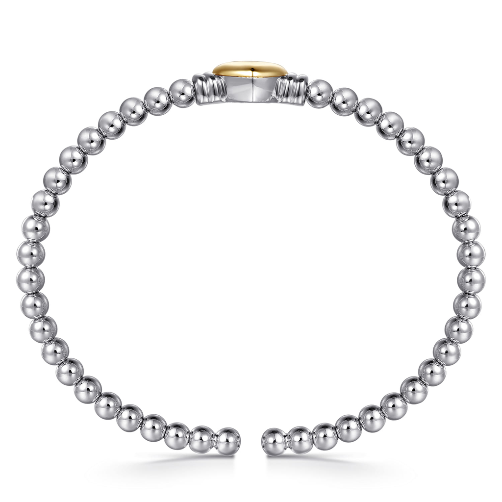 Silver beaded bracelet with a gold clasp on a white background