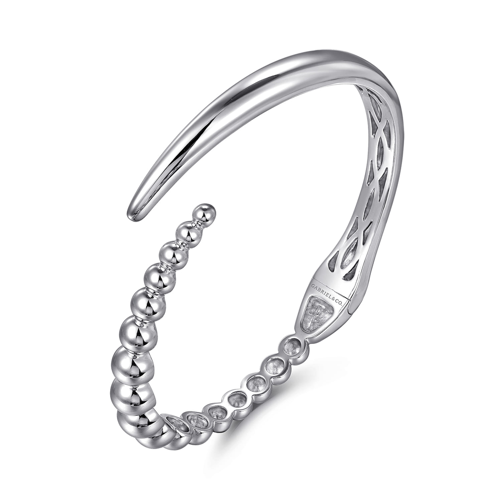 Silver bracelet with beaded design on a white background