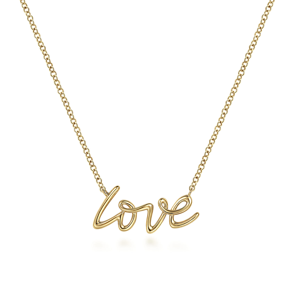 Gold 'love' necklace on a white background