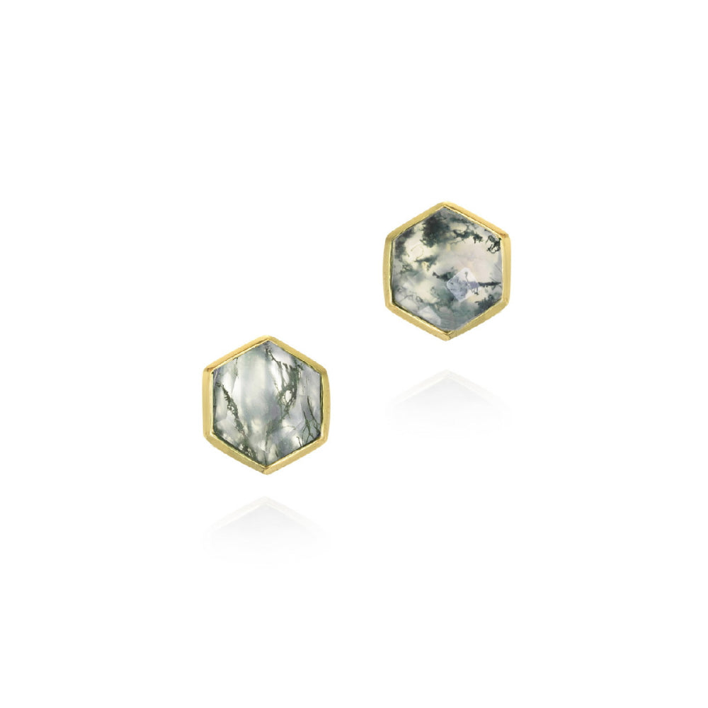A pair of hexagonal stud earrings featuring natural gray and white marbled stone in gold bezel settings, shown on a clean white background with soft reflections.