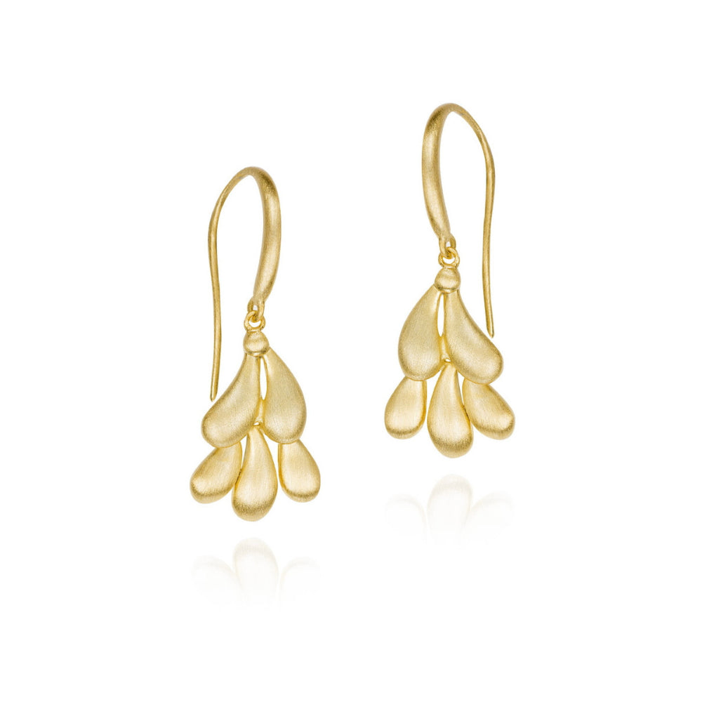 A pair of gold dangle earrings with a textured, layered petal-like design, shown on a clean white background with a soft reflection below.