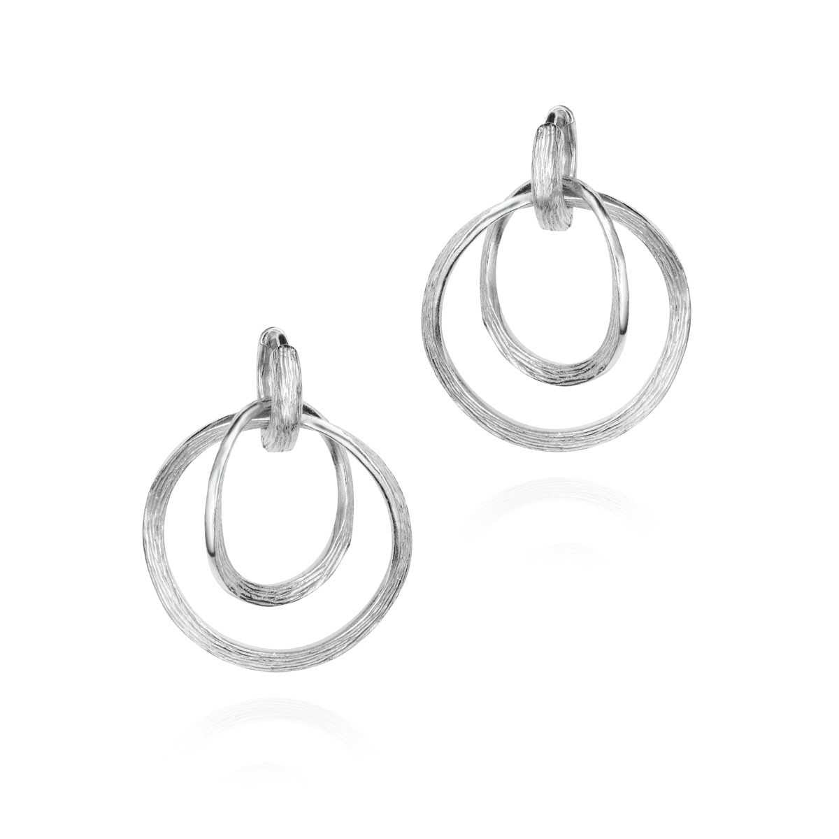 Pair of silver hoop earrings on a white background