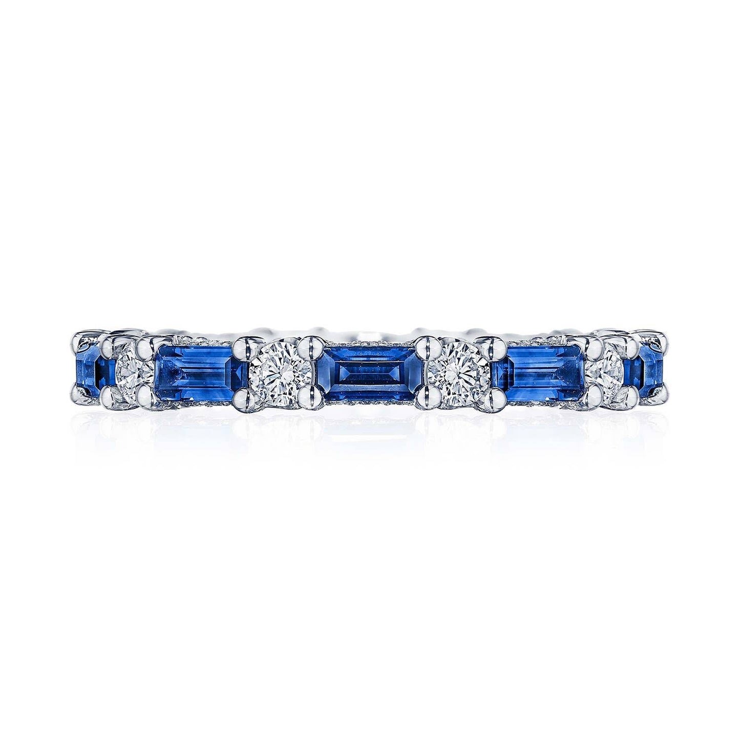 Eternity ring with blue sapphires and diamonds on a white background