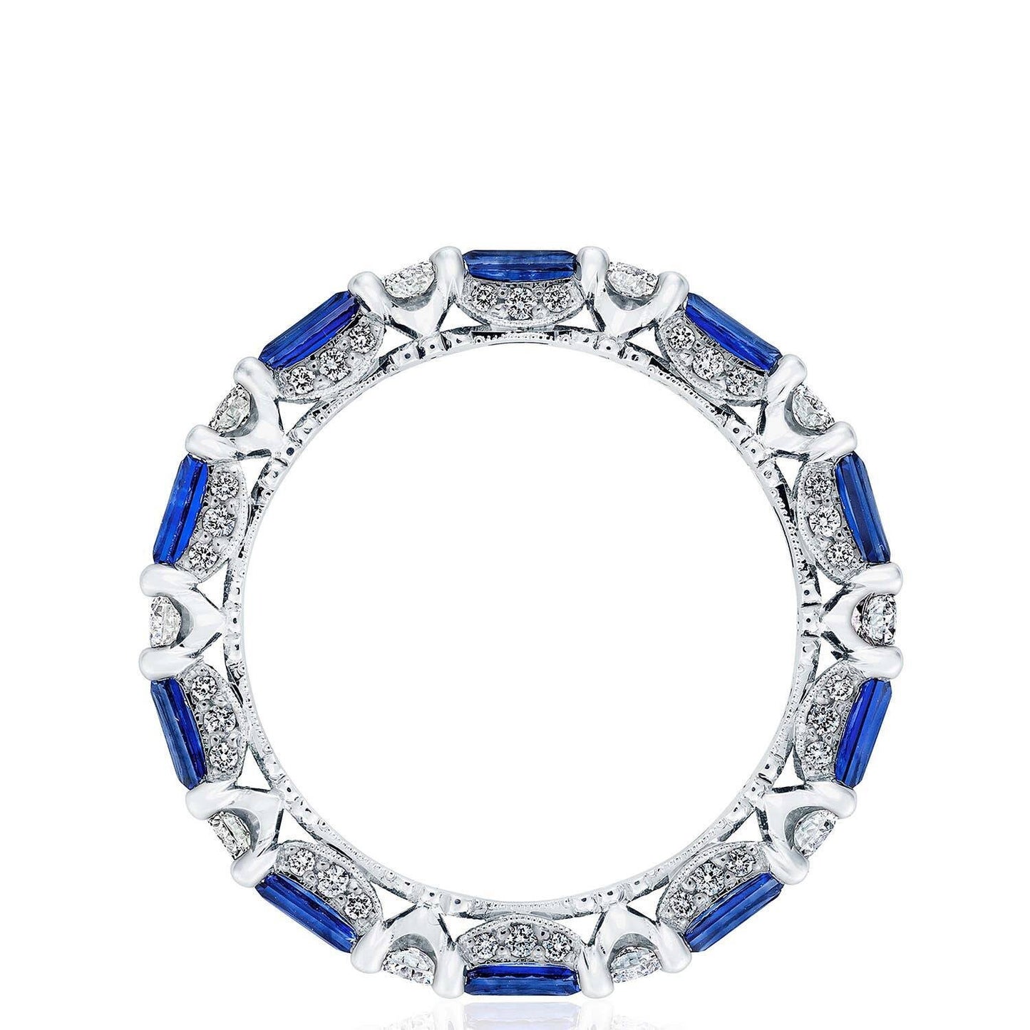 Elegant ring with blue gemstones and white accents on a white background