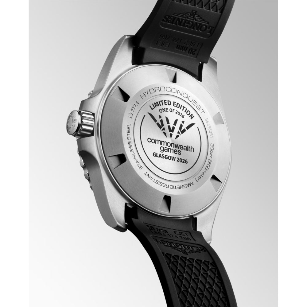Watch with black strap and silver case on a light gray background