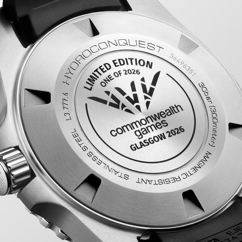 Close-up of a watch case with 'Commonwealth Games Glasgow 2026' branding.