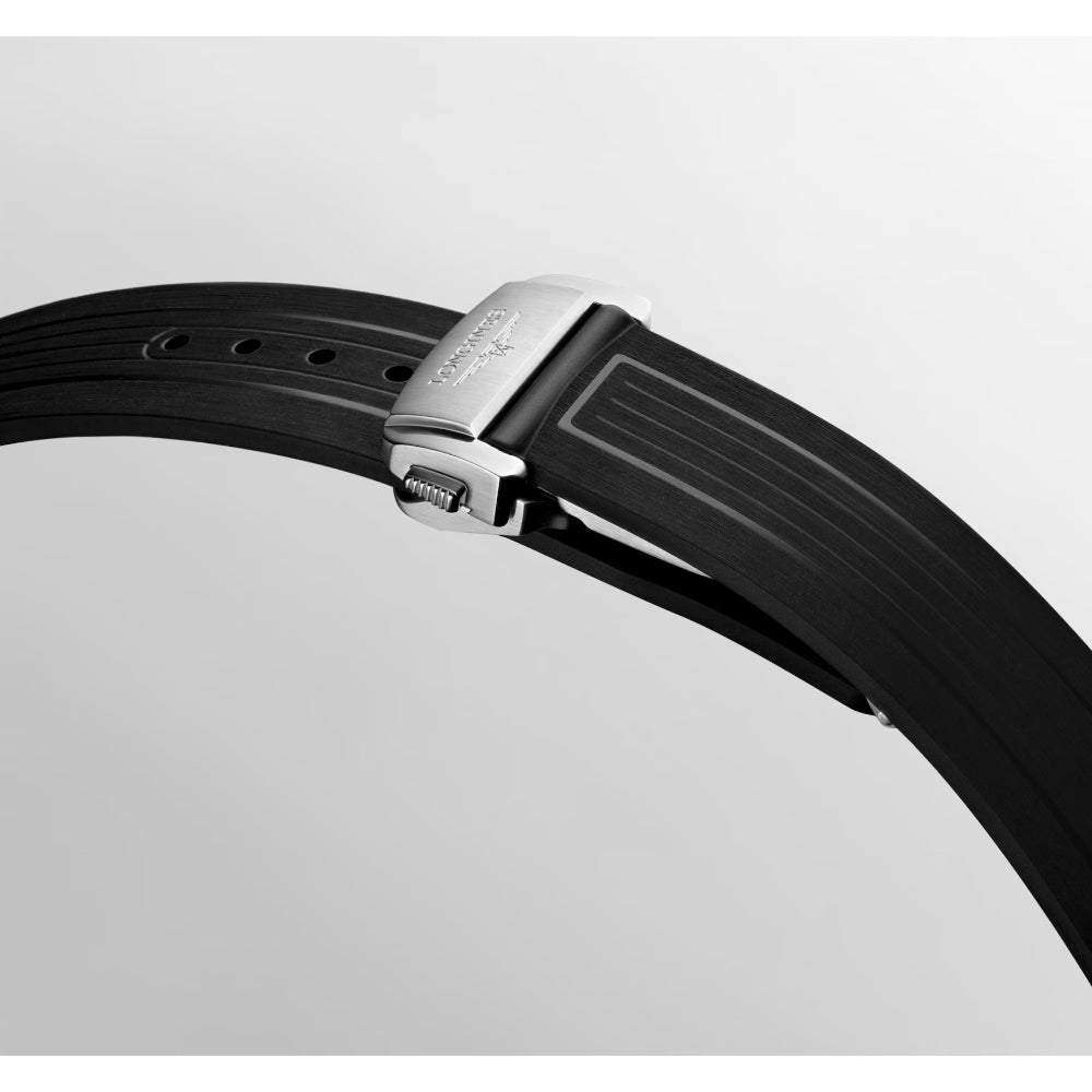 Close-up of a black watch strap with a silver buckle on a light gray background