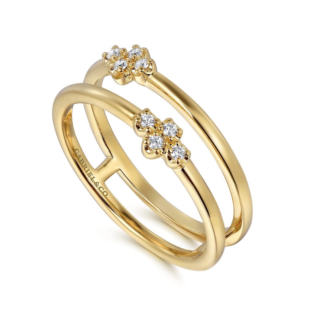 double row gold ring with diamonds on white background