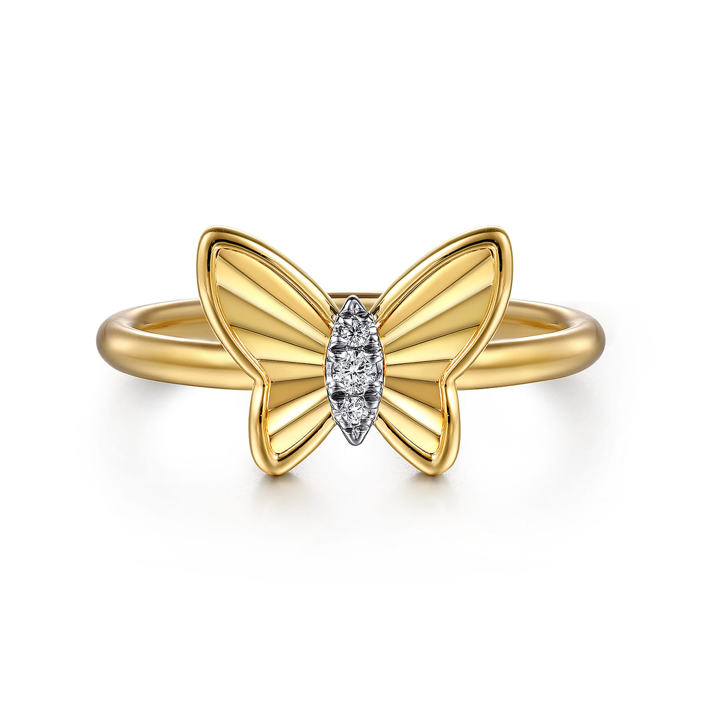 Gold butterfly ring with a diamond on a white background