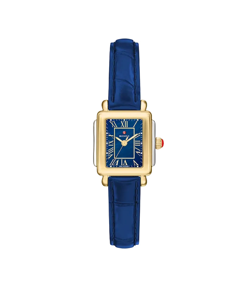 A luxury watch with a gold-tone rectangular case, a deep blue dial with gold Roman numerals and hands, and a matching blue leather strap, shown against a plain white background.