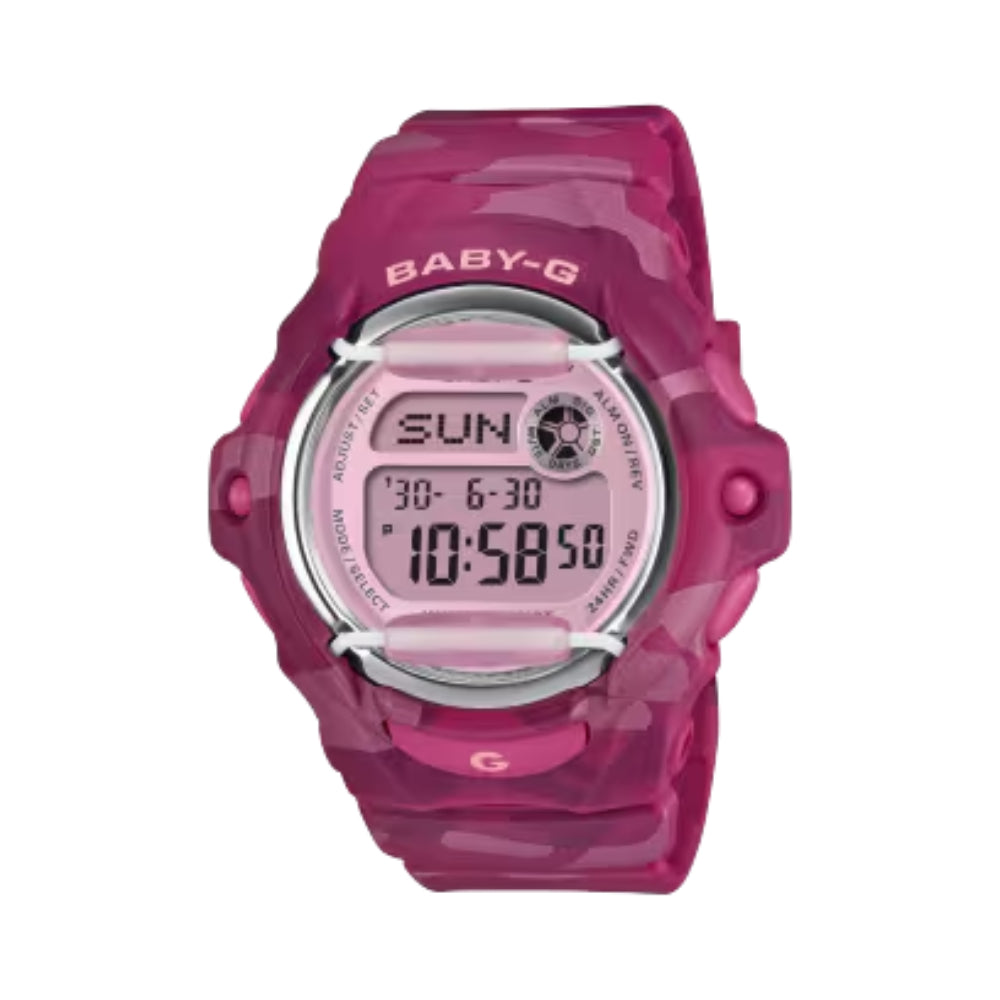 A pink translucent digital watch with a matching pink strap and bezel, featuring a silver-toned bezel and a digital display showing 'SUN 10:58:50'. The brand 'BABY-G' is printed above the watch face.