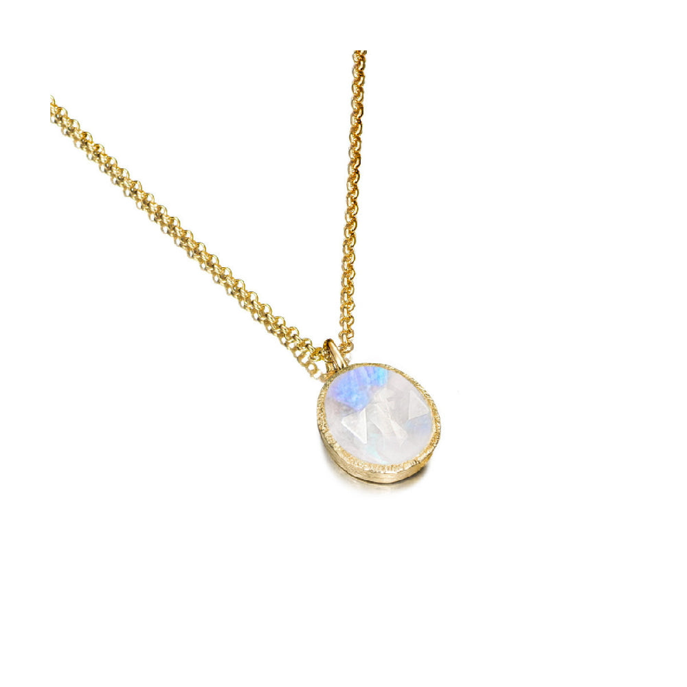 gold-tone necklace with white stone center on a white background