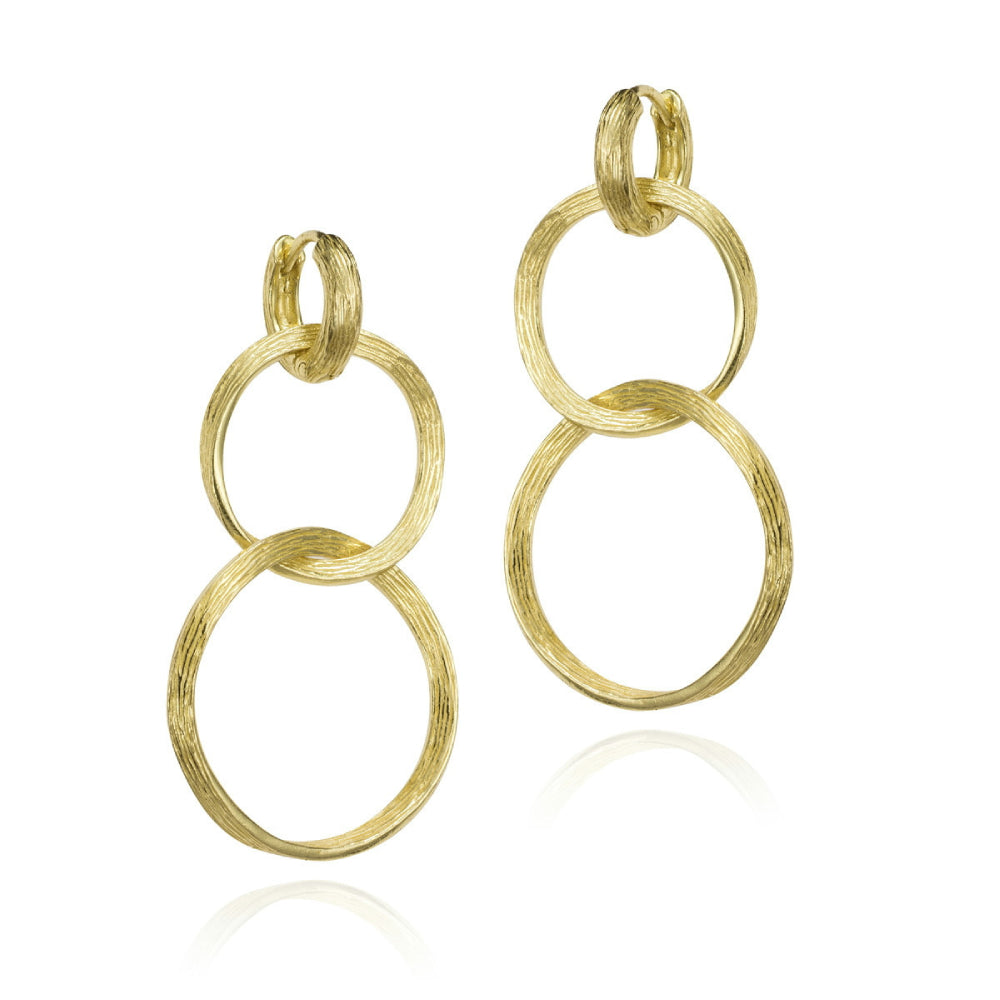 three gold rings intertwined on a white background