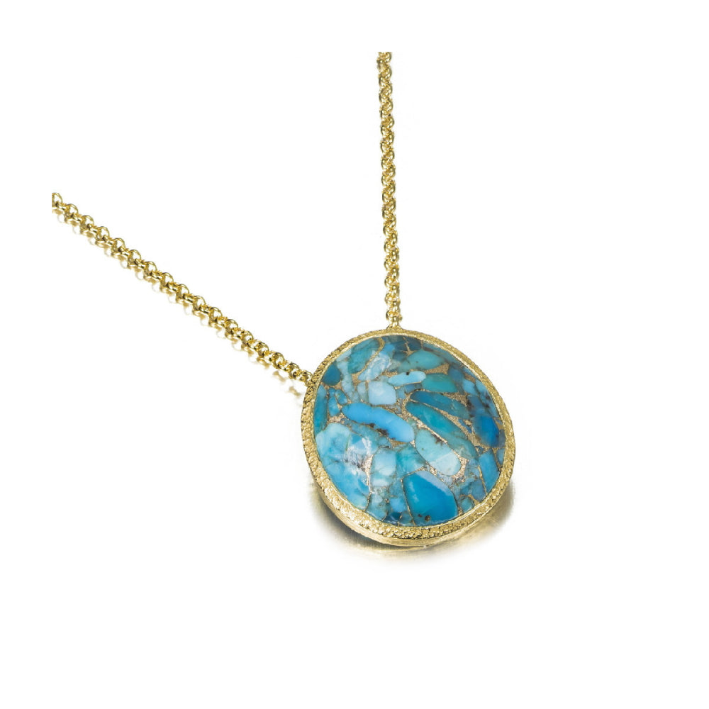 gold-tone necklace with blue stone center pendant on a white background on an angle