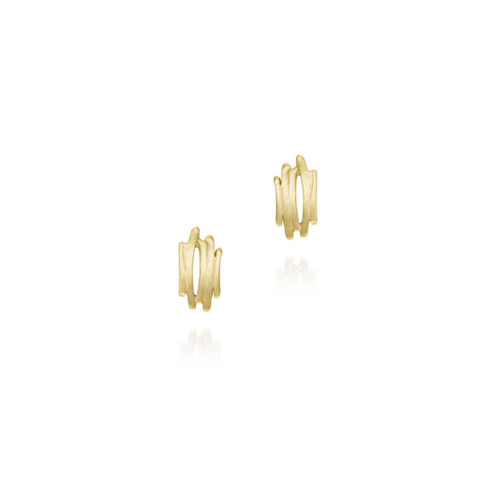 A pair of gold huggie hoop earrings with a textured, wavy vertical design, shown on a clean white background with soft reflections below.