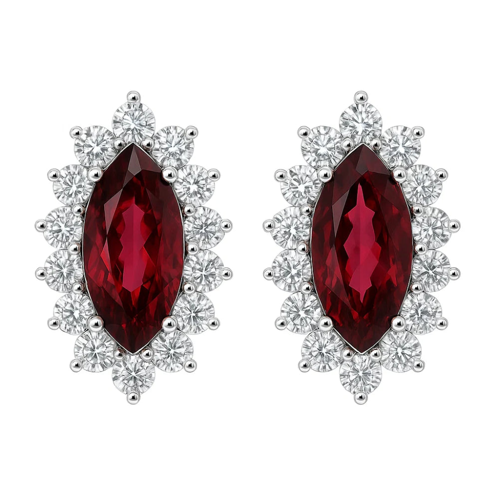 A pair of stud earrings featuring marquise-cut deep red gemstones surrounded by round clear stones in a silver-tone setting, shown on a plain white background.