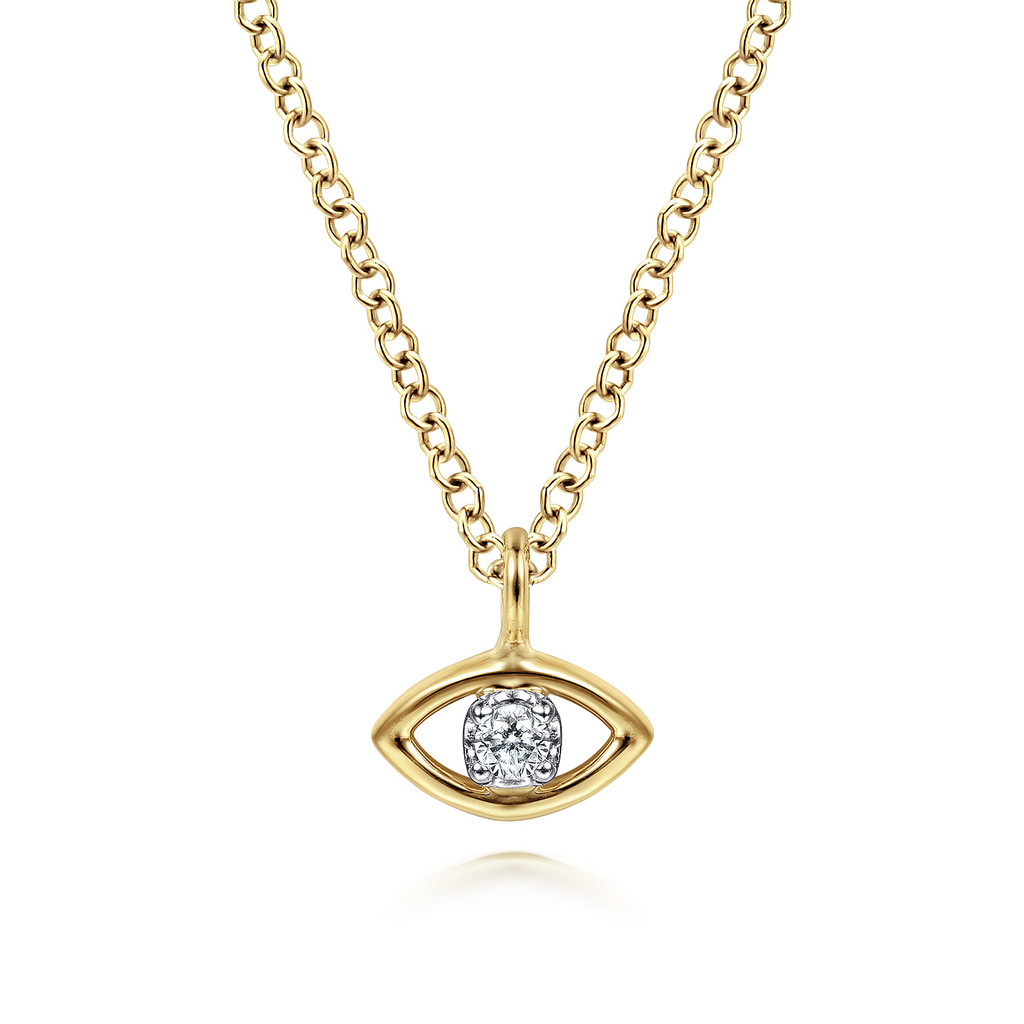 Gold necklace with a diamond-encrusted eye pendant on a white background