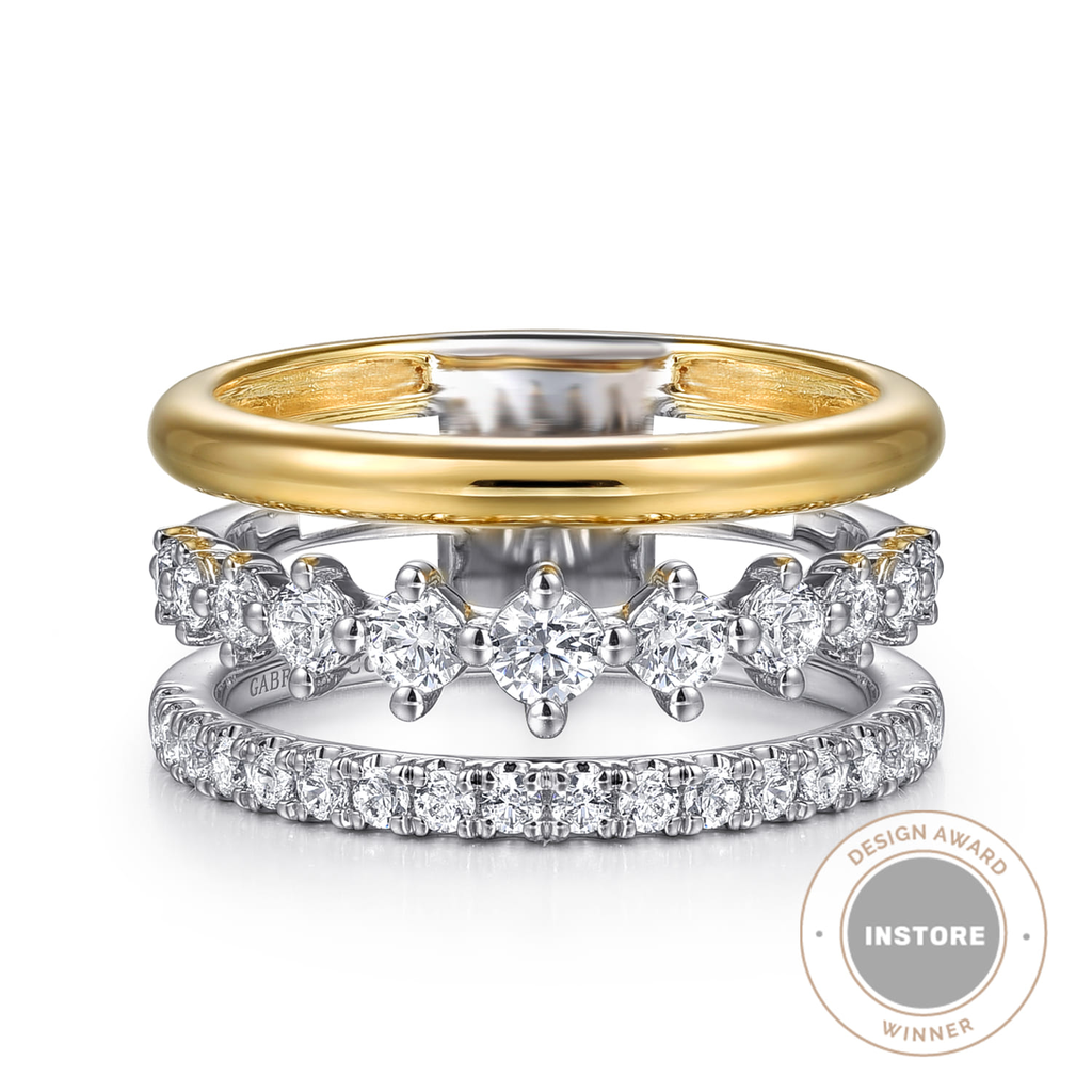 gold and silver triple band with clear stones on white background