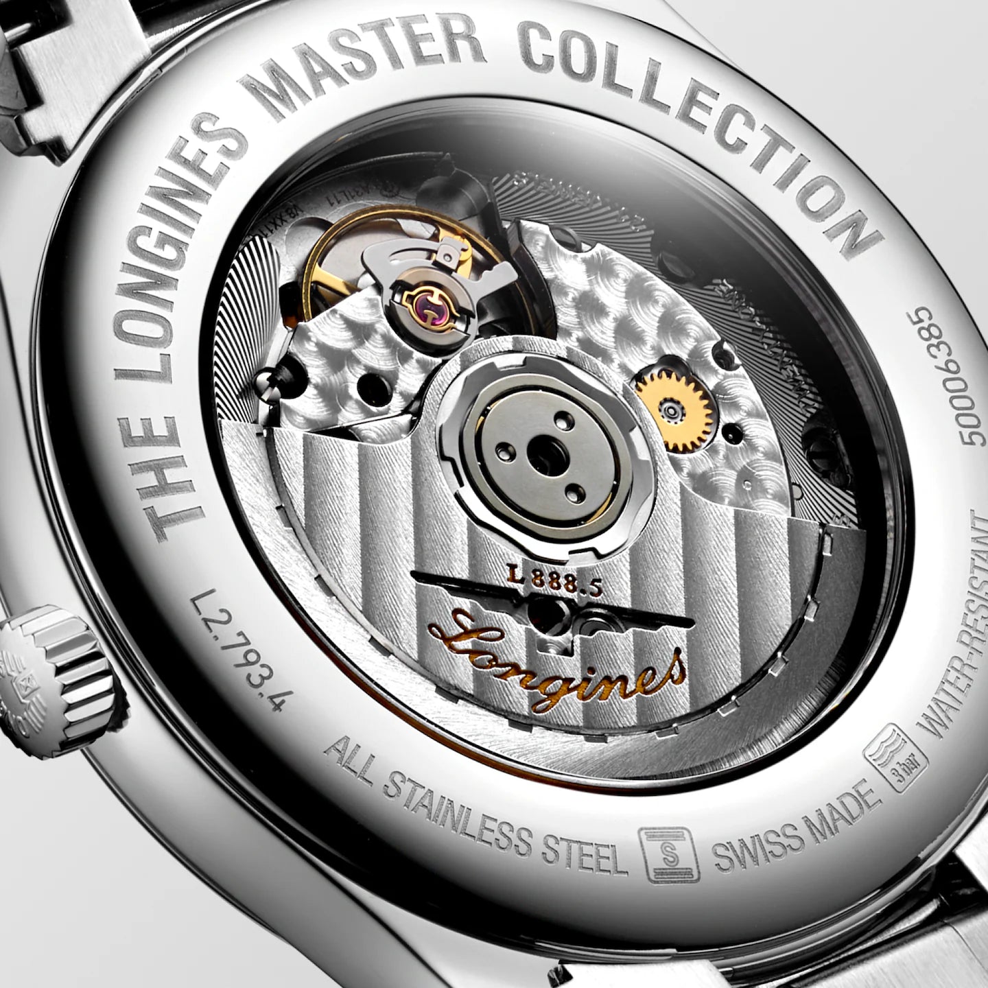 Close-up of a Longines watch mechanism with brand name and model details.