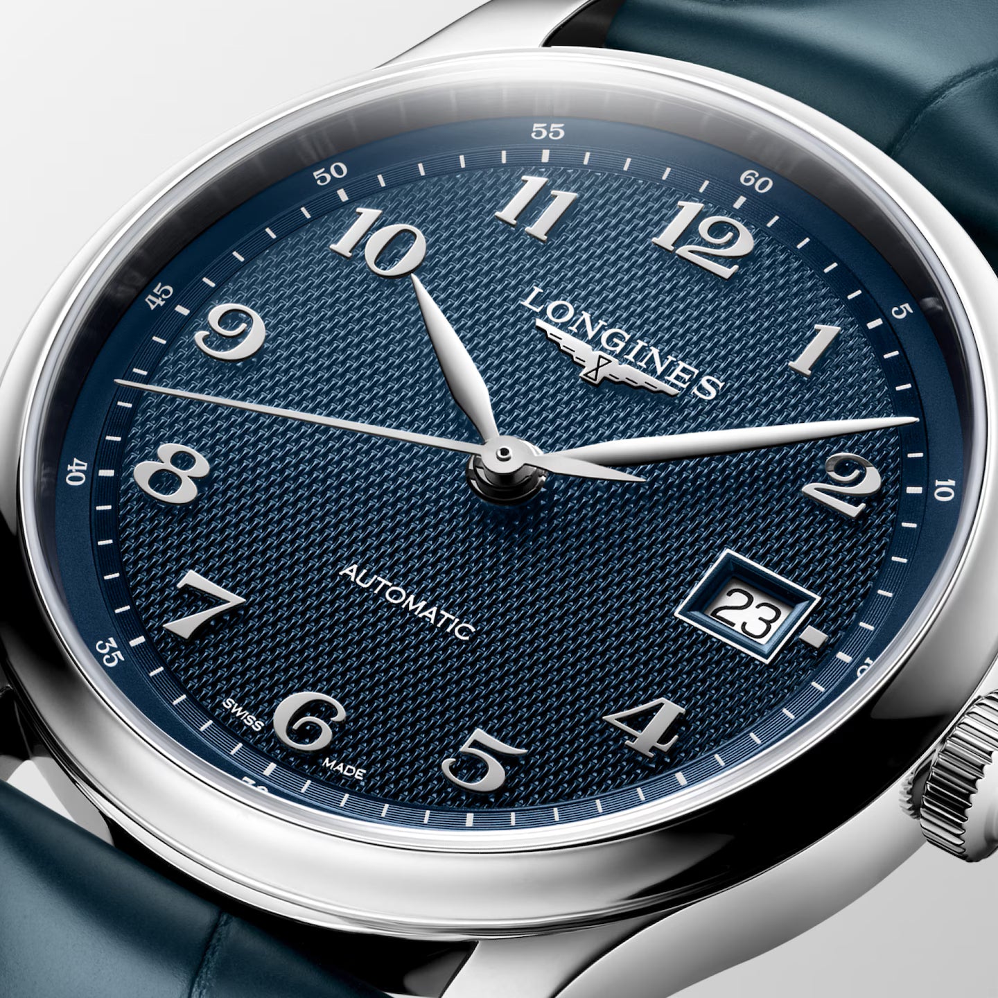 Longines watch with blue dial and silver case on a white background