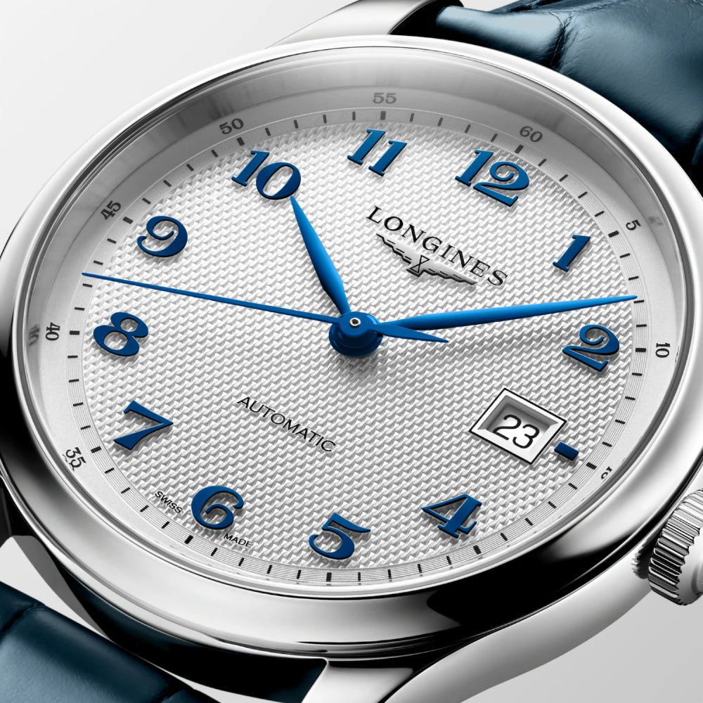 Longines watch with blue hands and numbers on a white face