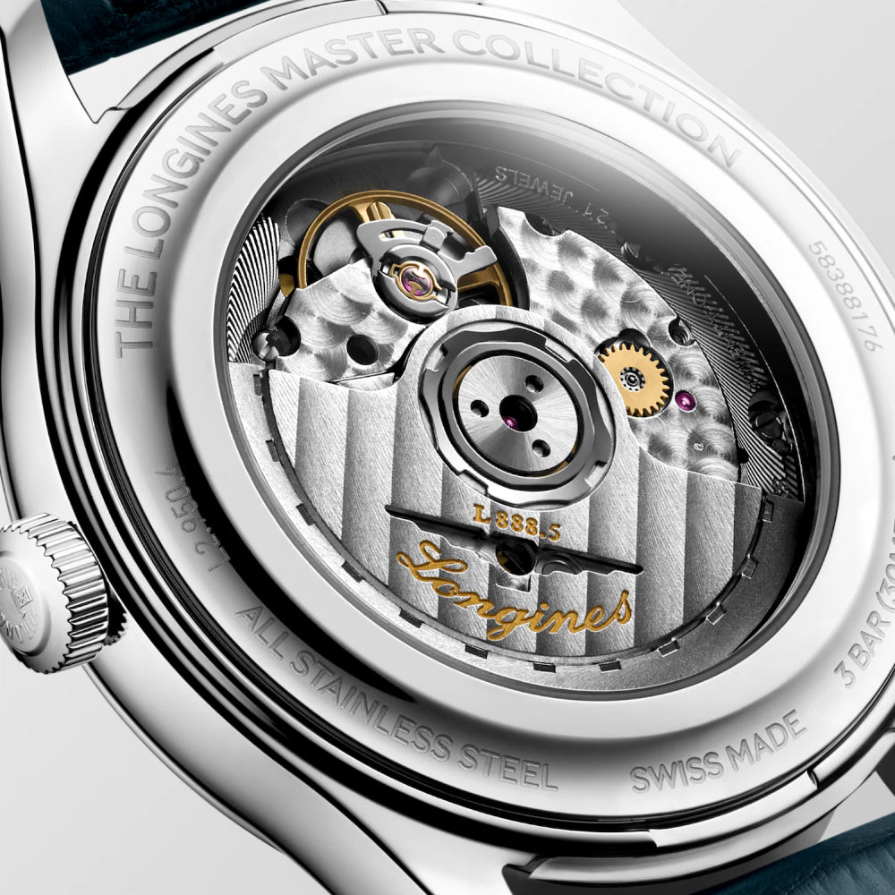 Close-up of a Longines watch mechanism with brand name visible