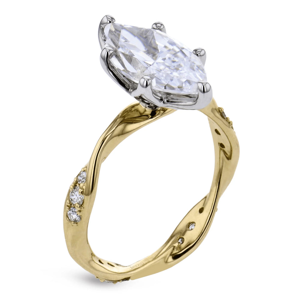 A yellow gold ring with a twisted band and small accent diamonds, featuring a large marquise-cut clear center stone in a silver-toned setting.