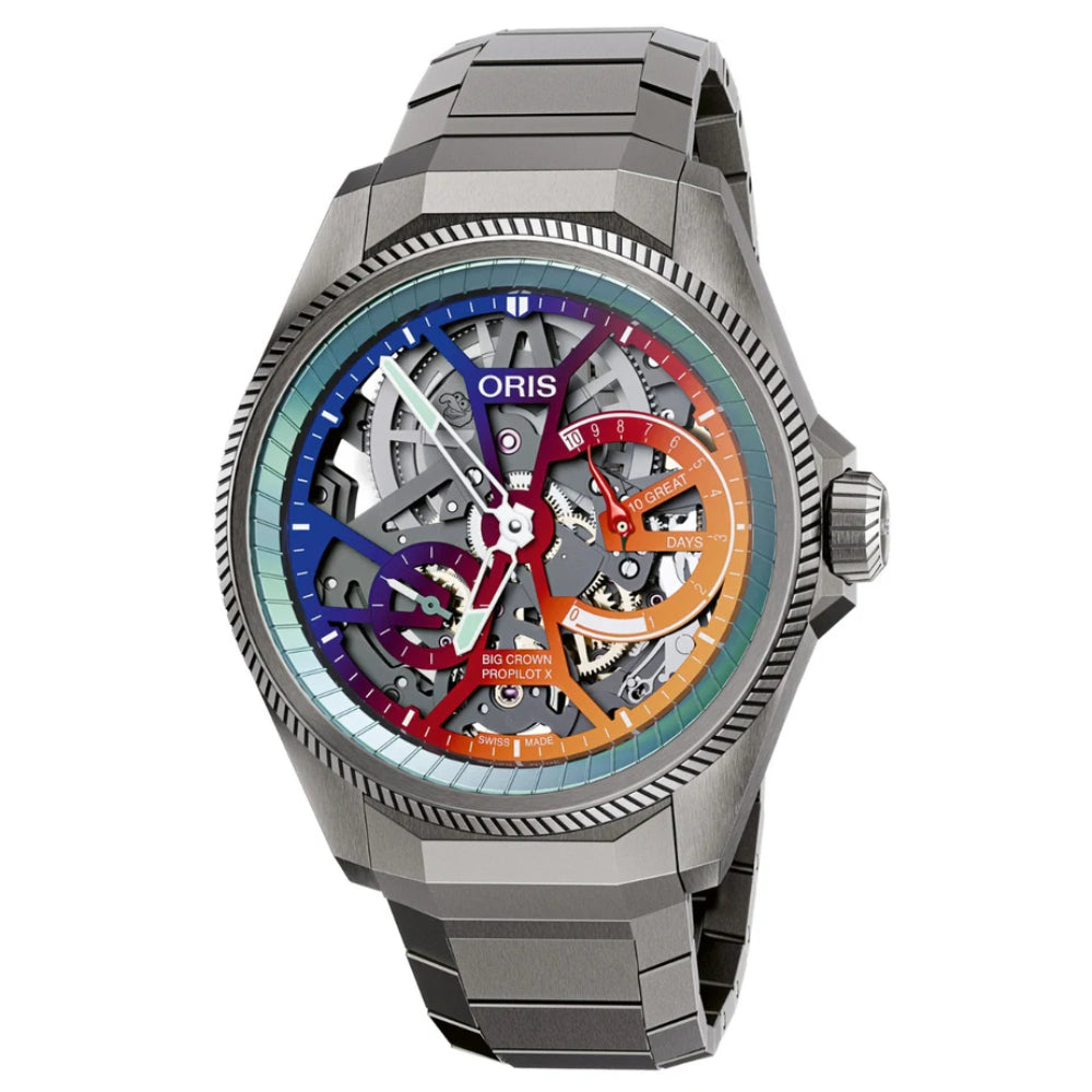 An Oris automatic skeleton watch with a dark gray metal case and link bracelet, featuring a colorful dial with blue, purple, red, and orange segments.