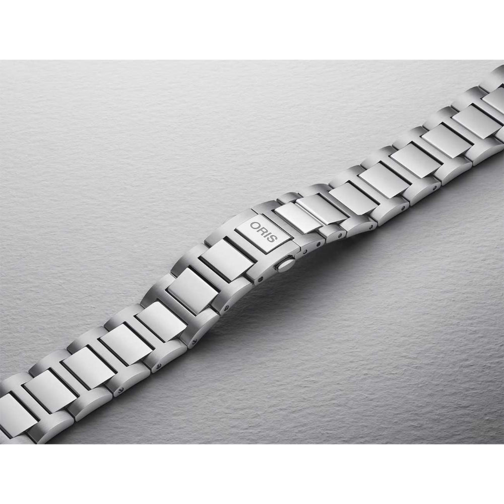 Silver watch strap on a metallic background
