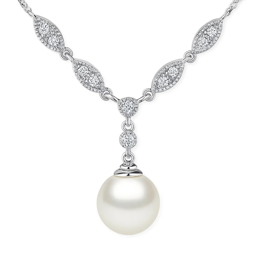A silver-toned necklace featuring a large white pearl pendant suspended below a chain of pavé-set marquise and oval diamonds, shown on a plain white background.