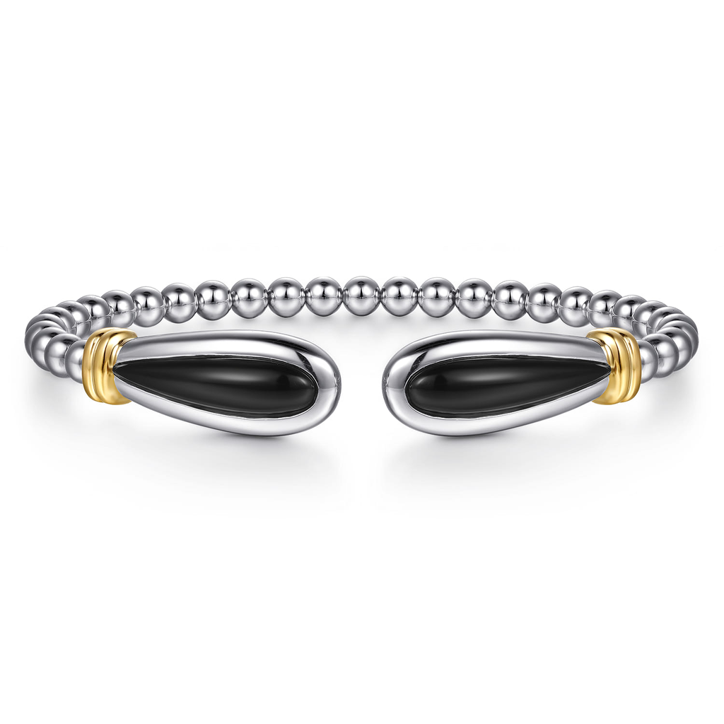 Diamond ring with a large central gemstone on a white background
