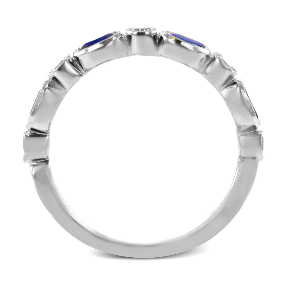Silver ring with blue gemstone on a white background