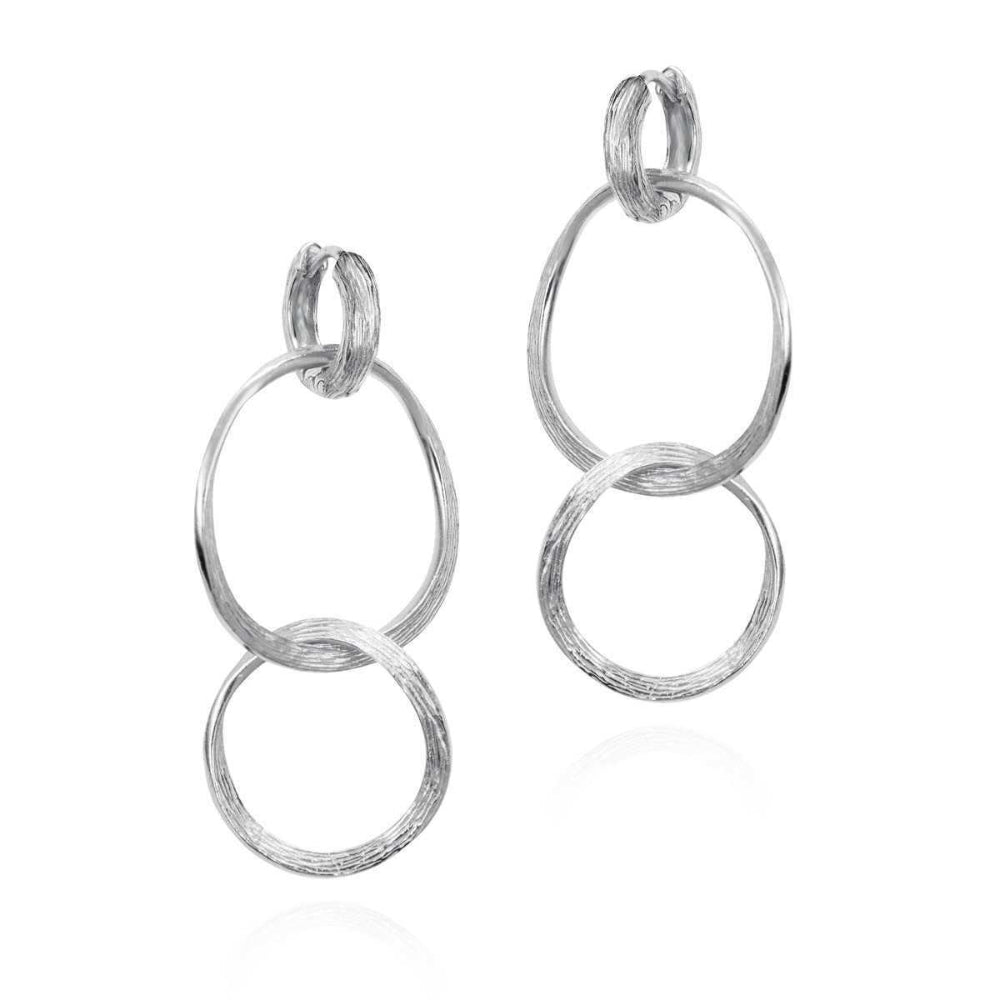 Pair of silver hoop earrings on a white background